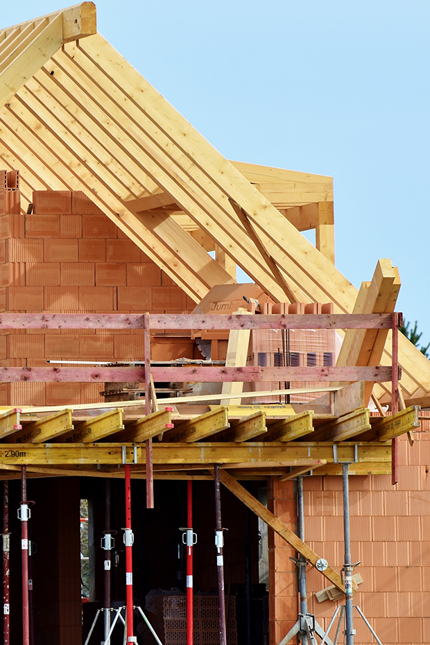 Image of a house under construction after a natural disaster.